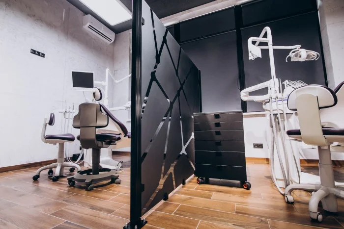 Fully equipped modern dental clinic with two dental chairs and medical equipment
