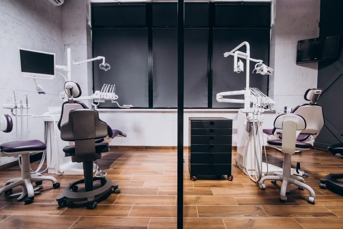 Dental Clinic with two fully equipped dental treatment chairs and modern dental instruments